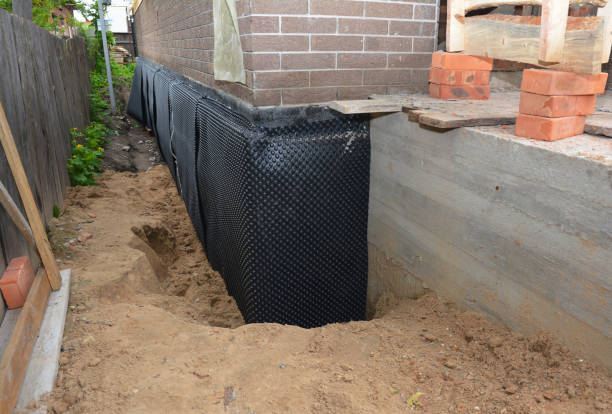 Happy homeowners after waterproofing job in Kearny